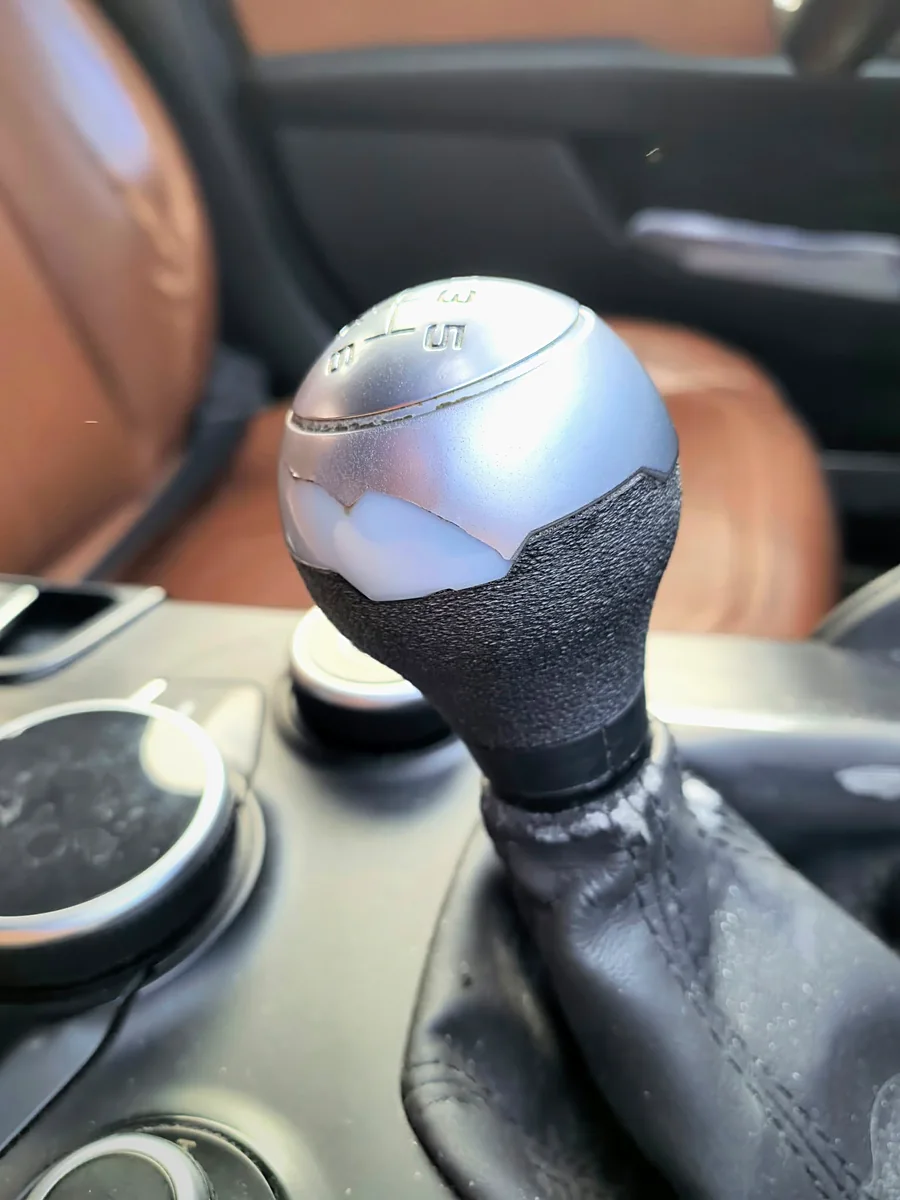 The finished knob in the car: the new textured lower part under the original silver top